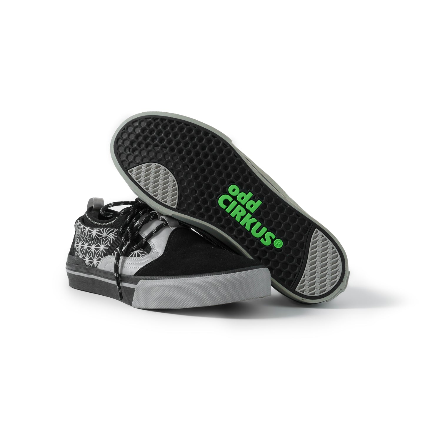 Black and gray sneaker with 'odd Cirkus' branding on a white background
