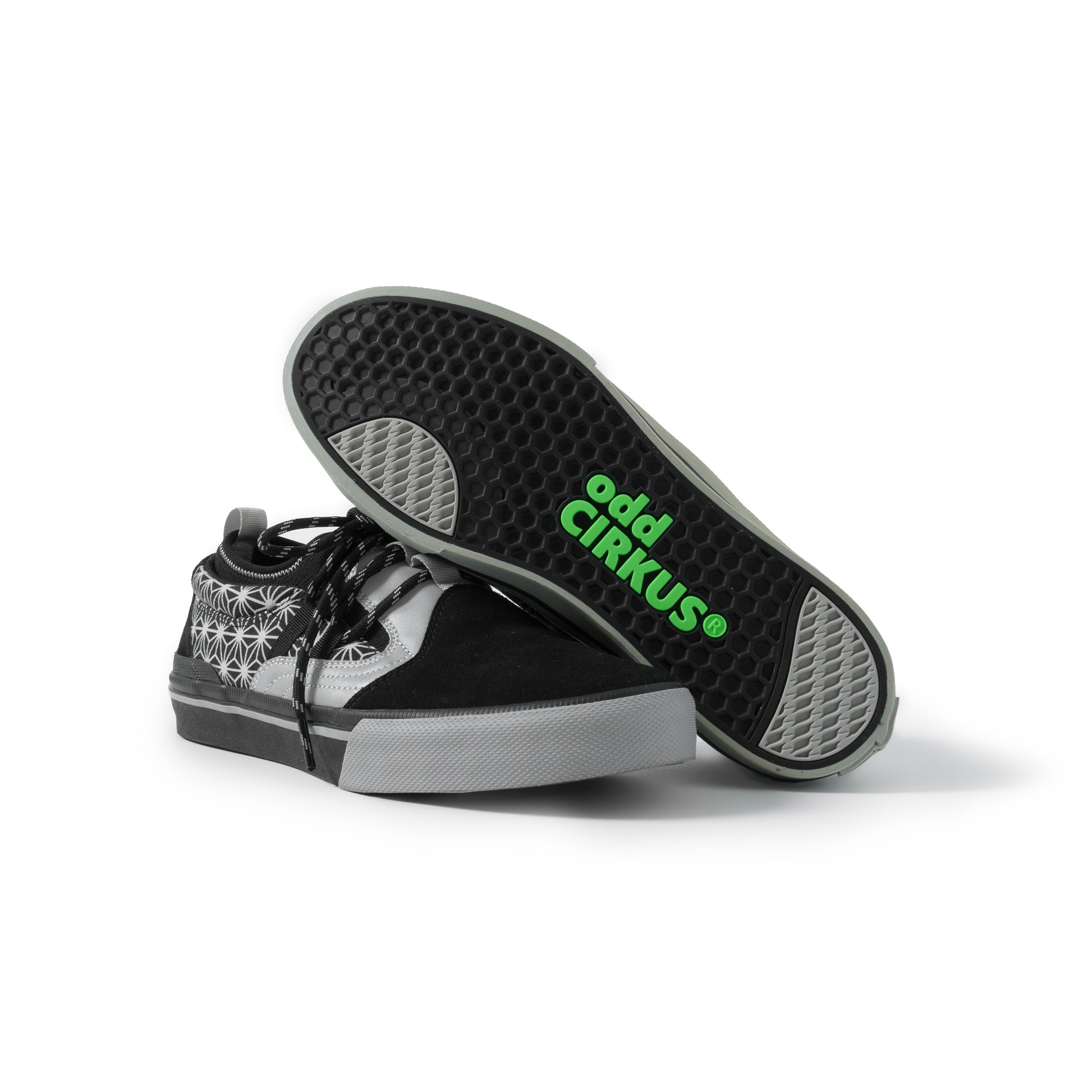 Black and gray sneaker with 'odd Cirkus' branding on a white background