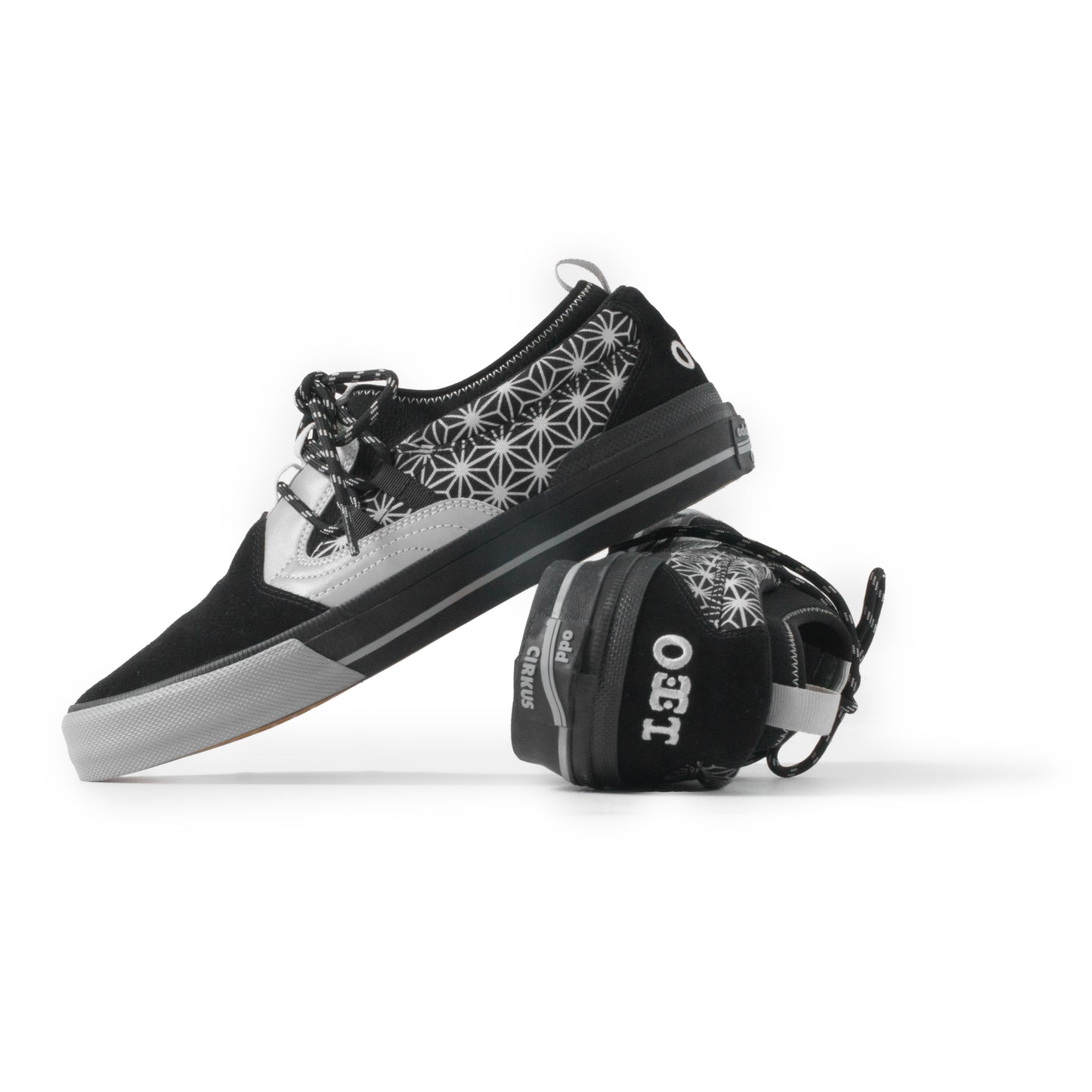 Black and white sneaker with geometric pattern on a white background