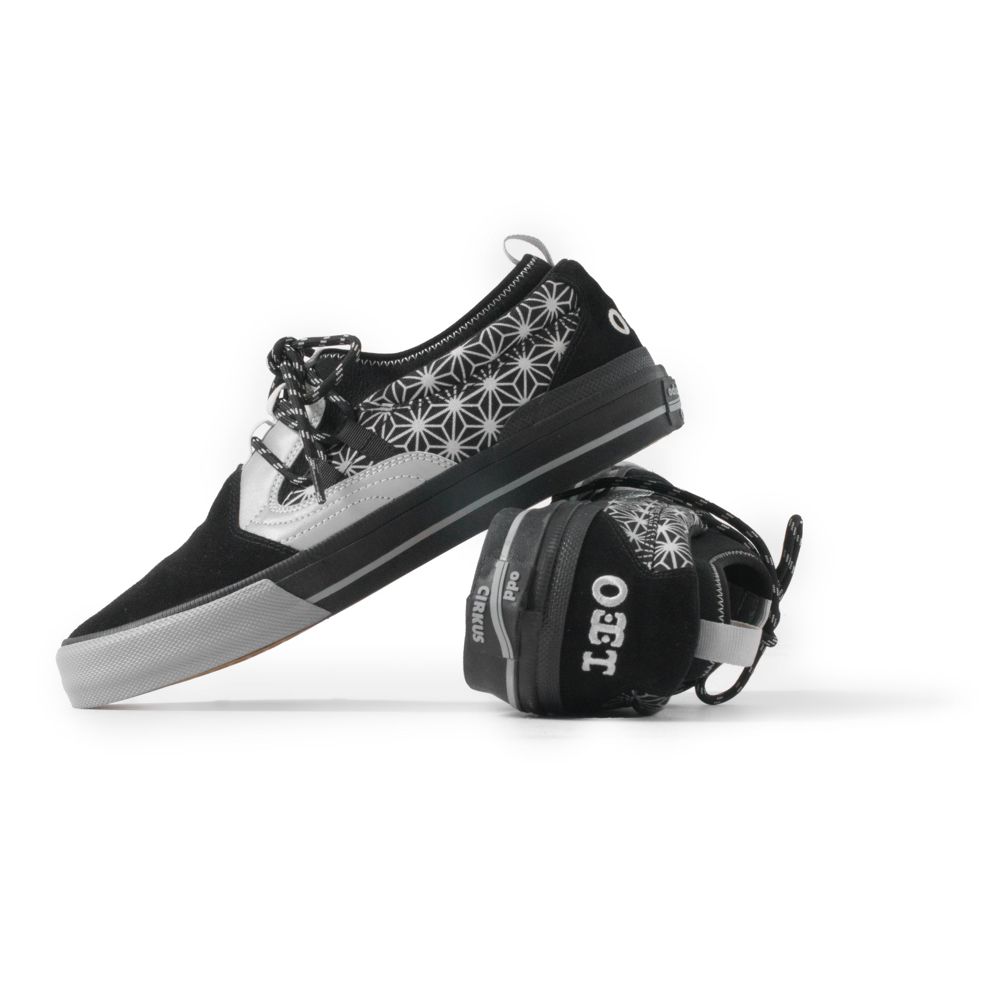 Black and white sneaker with geometric pattern on a white background